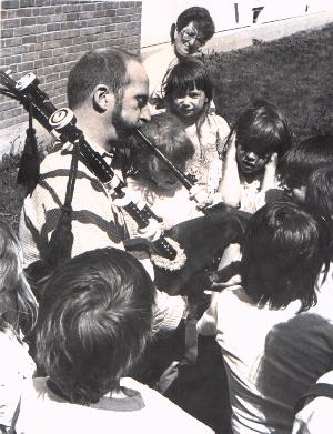 Terry plays bagpipes for kids